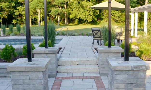 Create an inviting entrance with pavers, brick and stone