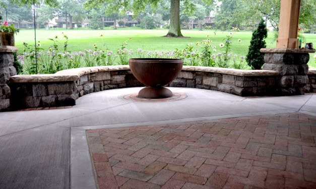 Create an inviting entrance with pavers, brick and stone