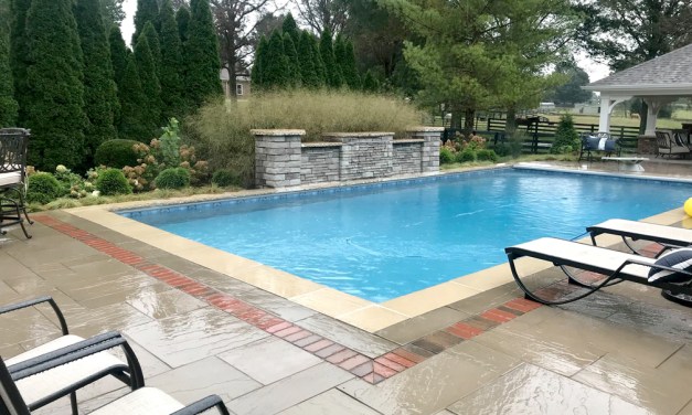 Create an inviting entrance with pavers, brick and stone