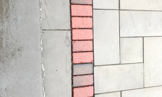 Create an inviting entrance with pavers, brick and stone