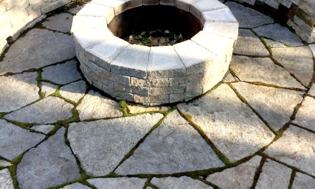 Create an inviting entrance with pavers, brick and stone
