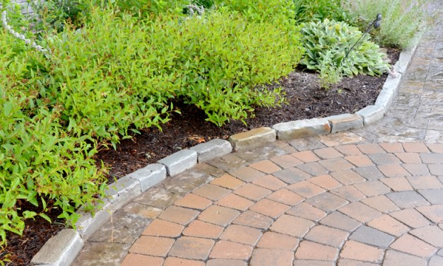 Create an inviting entrance with pavers, brick and stone
